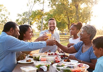 Multi,Generation,Family,Enjoying,Picnic,In,Park,Together